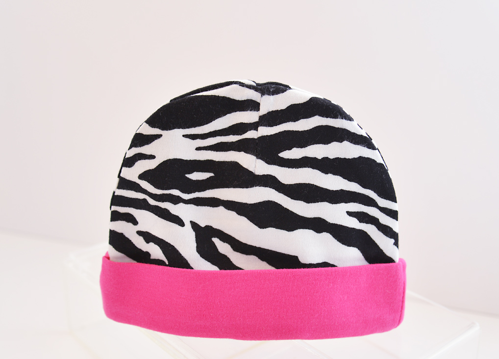 baby cap. black zebra with hot pink trim.
